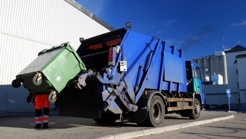 Builders skip hire container delivered in Southfields construction site