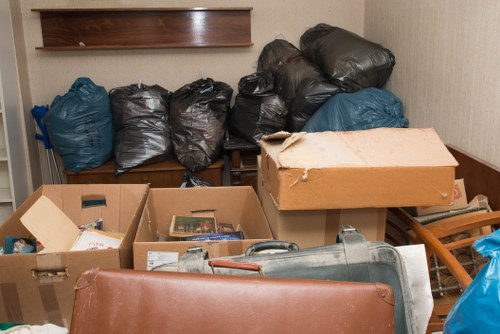 Construction workers sorting waste materials in Southfields